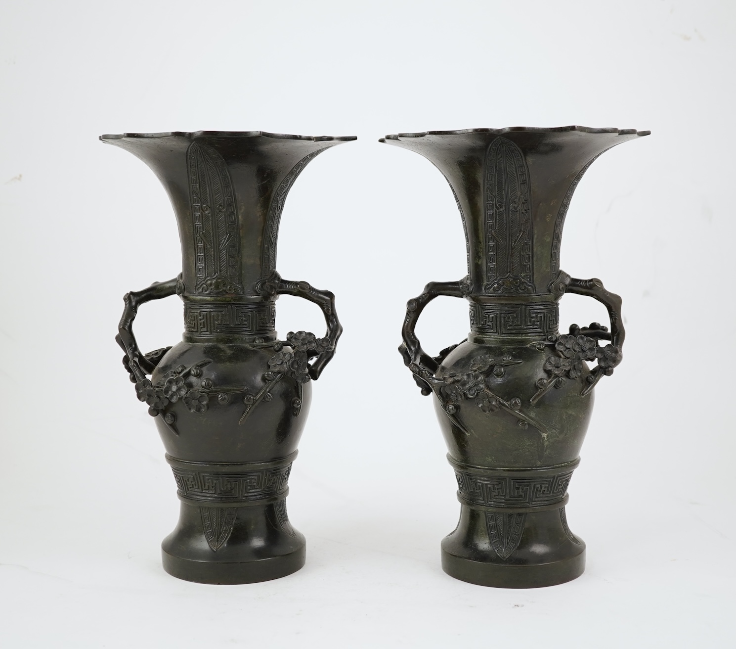 A pair of Chinese bronze gu-shaped vases, Qing dynasty